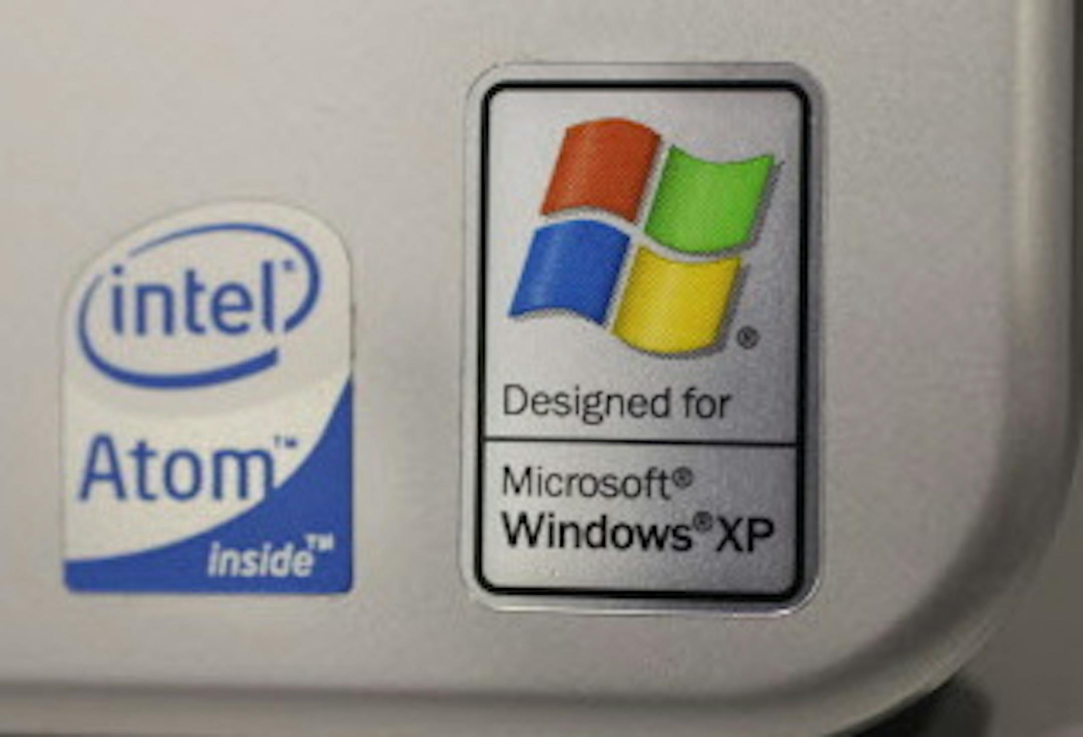 FILE - This July 22, 2009 file photo shows a Windows XP logo on a Hewlett Packard Laptop at a Best Buy in Mountain View, Calif. On Tuesday, April 8, 2014, Microsoft will end support for its still popular Windows XP. With an estimated 30 percent of businesses and consumers still using the 12-year-old operating system, the move could put everything from the data of major financial institutions to the identities of everyday people in danger if they don&#xed;t find a way to upgrade soon. (AP Photo/P