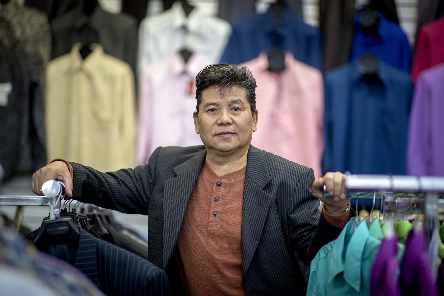 Long Her, a Hmong refugee, voted for Hillary Clinton in 2016, but now he's considering voting for Trump after his business, New Fashions Tailoring & Alterations in St. Paul, was devastated by riots.