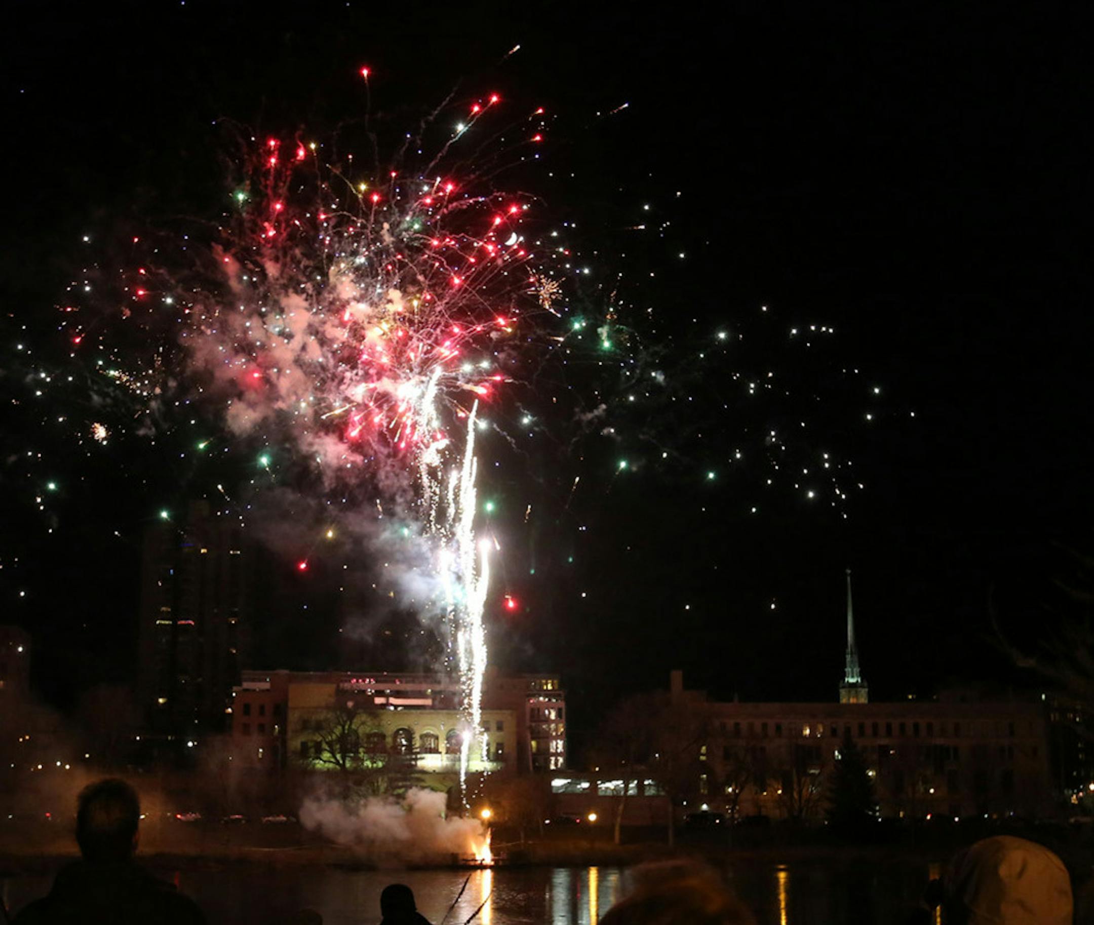 Fireworks lit up the sky on the opening night of Holidazzle on Thursday in Minneapolis' Loring Park.