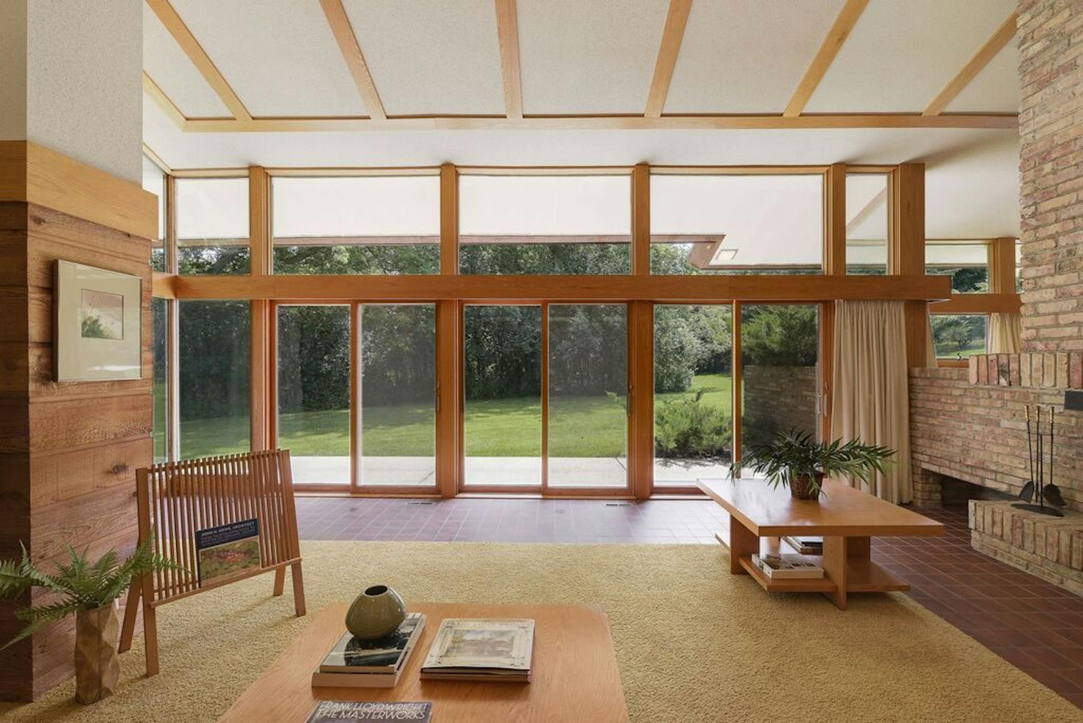 The living room has expansive views of the backyard.