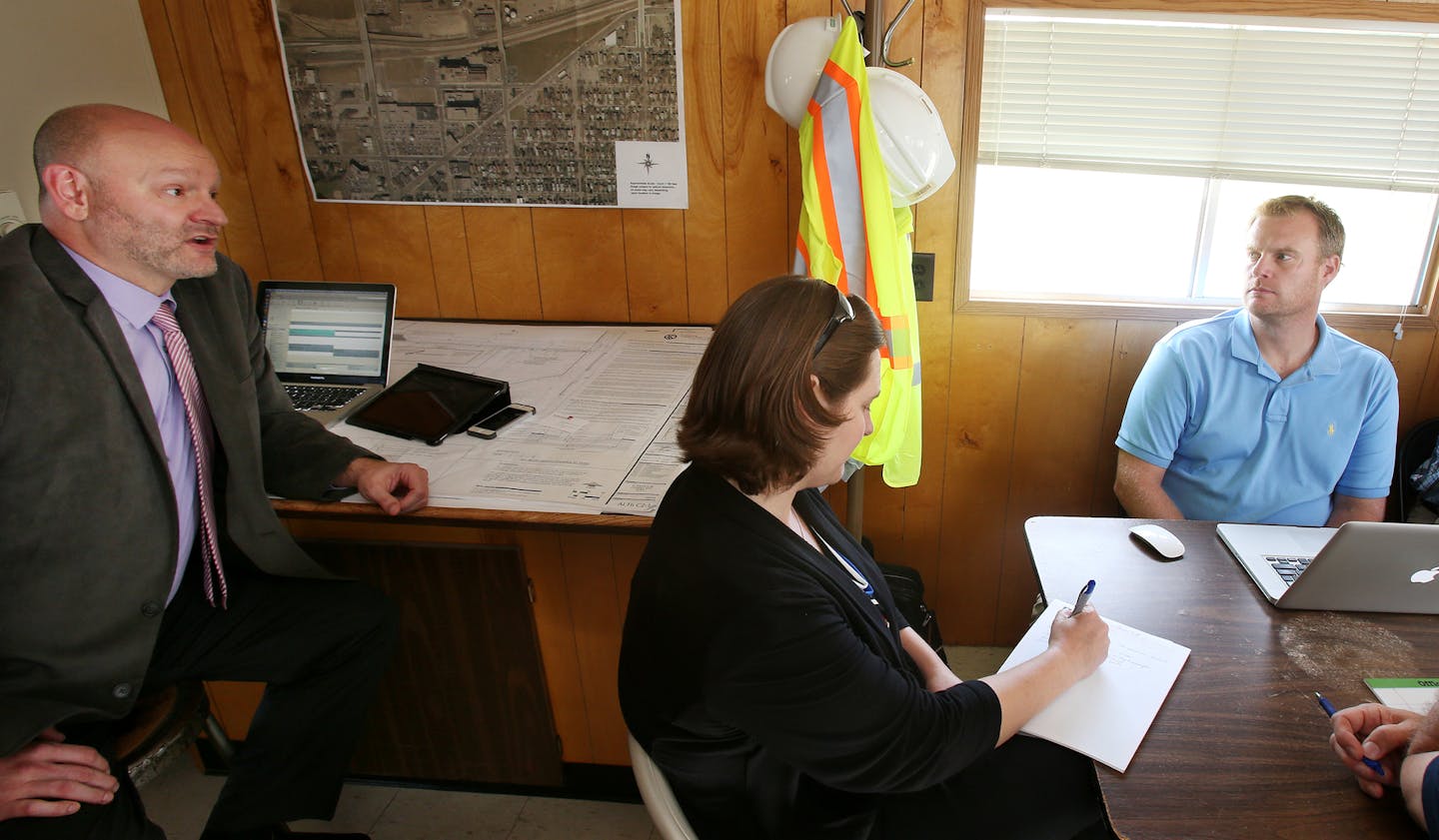 From left, Monte Hilleman and Kathryn Sarnecki, of the St. Paul Port Authority, met with consultants including Eric Beazley to talk over redevelopment efforts in St. Paul&#x2019;s East Side.