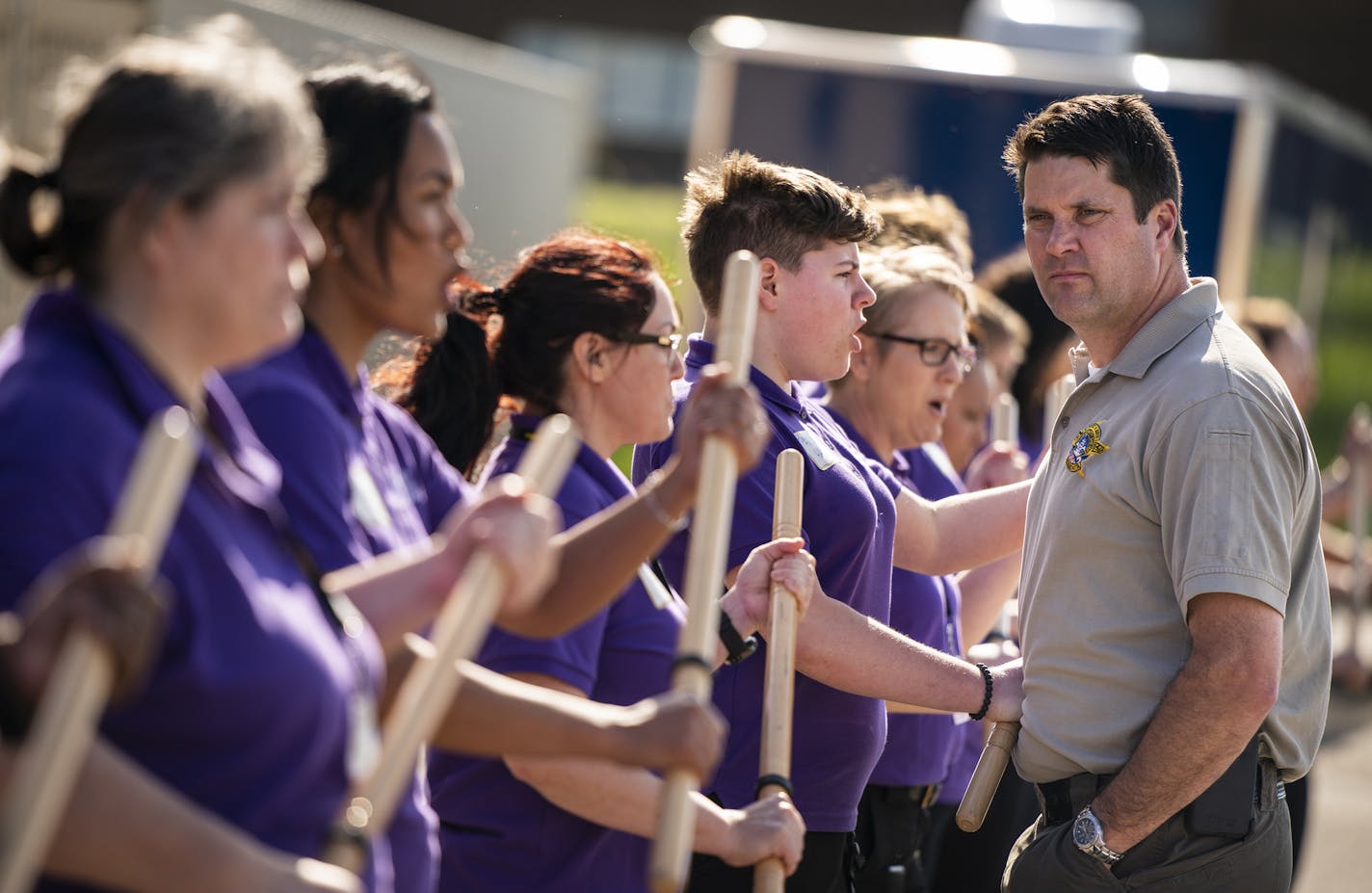 Dep. Mike Servatka, right, the Platoon Sergeant over the Ramsey County Sheriff's Office's Mobile Field Force, trains the Women's Academy participants, including Paxton Hall, center, on mobile field force tactics to push back protesters. ] LEILA NAVIDI &#x2022; leila.navidi@startribune.com BACKGROUND INFORMATION: Members of the 2019 Ramsey County Sheriff's Office Women's Academy learn mobile field force tactics during the third day of the academy at Ramsey County Sheriff's Department Patrol Divis