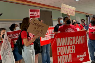 Immigrant rights advocates on Thursday rallied outside the Minneapolis City Council chambers, demanding city leaders implement a list of “pro-immigr