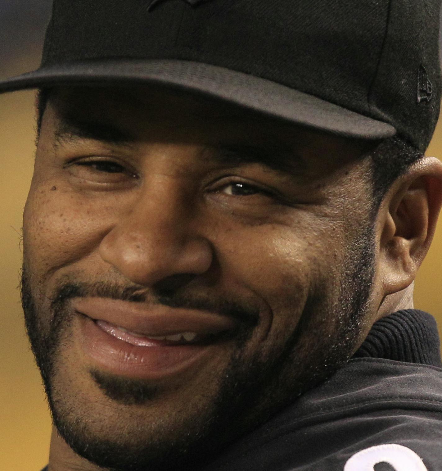 Retired Pittsburgh Steelers running back Jerome Bettis stands on the sidelines during a ceremony honoring the Pittsburgh Steelers 80th anniversary team before an NFL football game against the Baltimore Ravens in Pittsburgh, Sunday, Nov. 18, 2012. The Ravens won 13-10. (AP Photo/Gene J. Puskar)