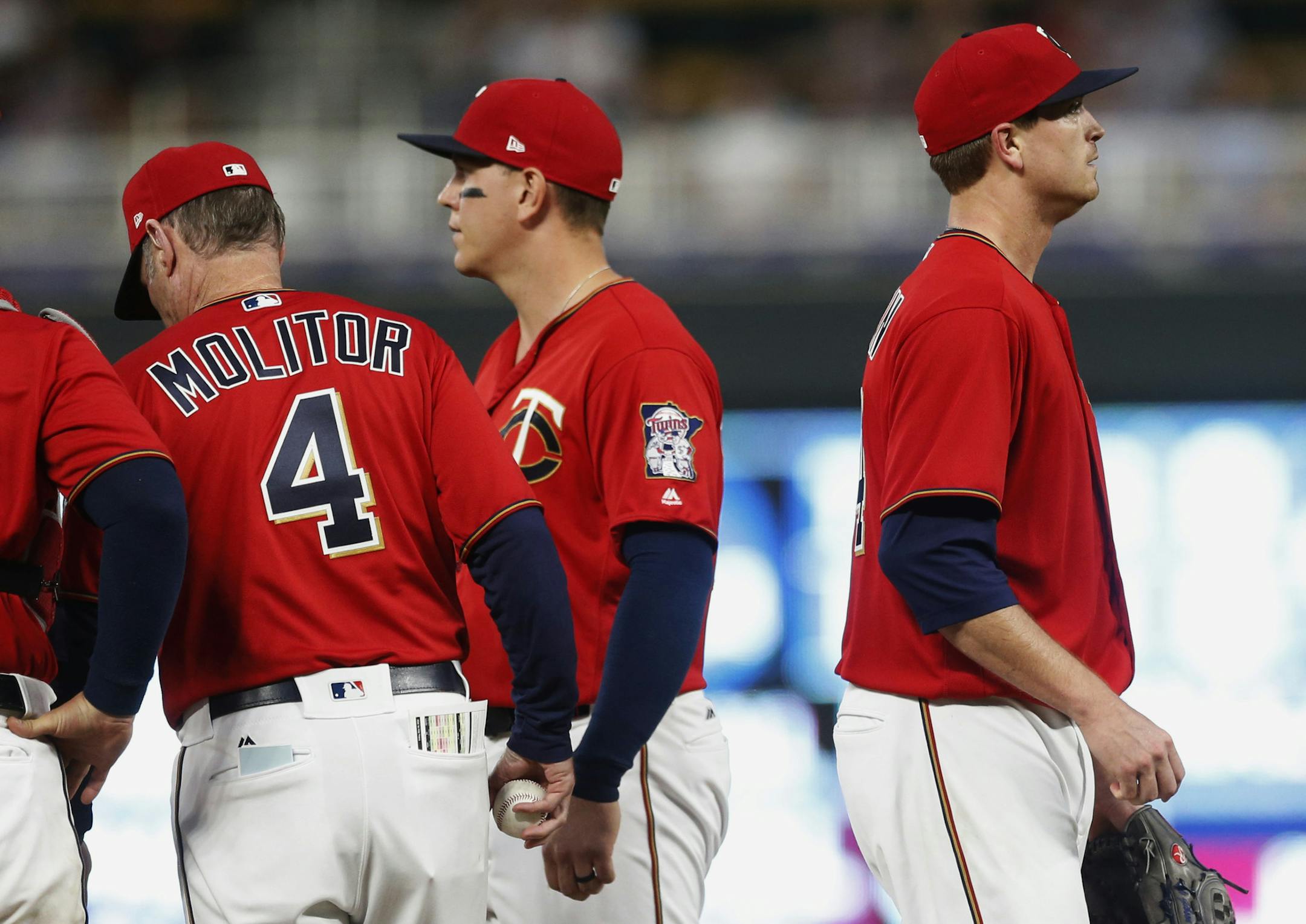 Minnesota Twins pitcher Kyle Gibson, right, heads to the dugout after he was pulled in the sixth inning of a baseball game against the Milwaukee Brewers, Friday, May 18, 2018, in Minneapolis. (AP Photo/Jim Mone)