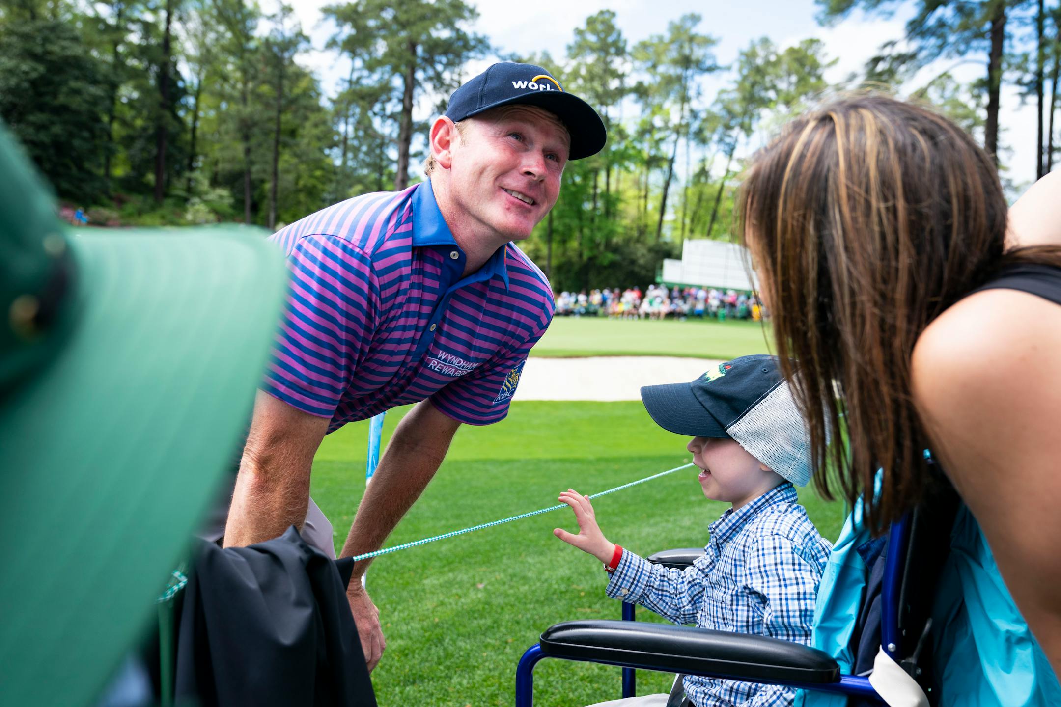 Brandt Snedeker talked to six-year-old fan Caleb Daniel during a rainy practice round before the Masters at Augusta National in Augusta, Ga., on Monday.