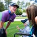 Brandt Snedeker talked to six-year-old fan Caleb Daniel during a rainy practice round before the Masters at Augusta National in Augusta, Ga., on Monda