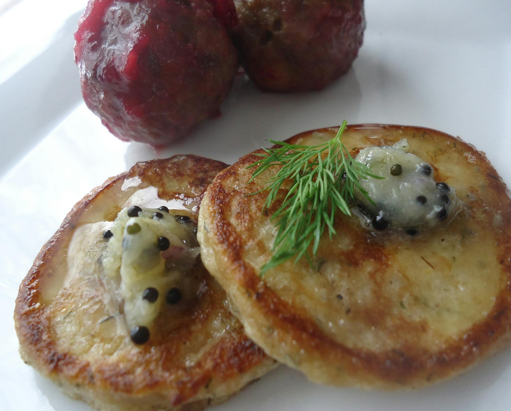 Credit: Patrice Johnson, Special to the Star Tribune Modern Swedish Meatballs with Lingonberry Reduction, Rye-Dill Blini with Roe Butter.