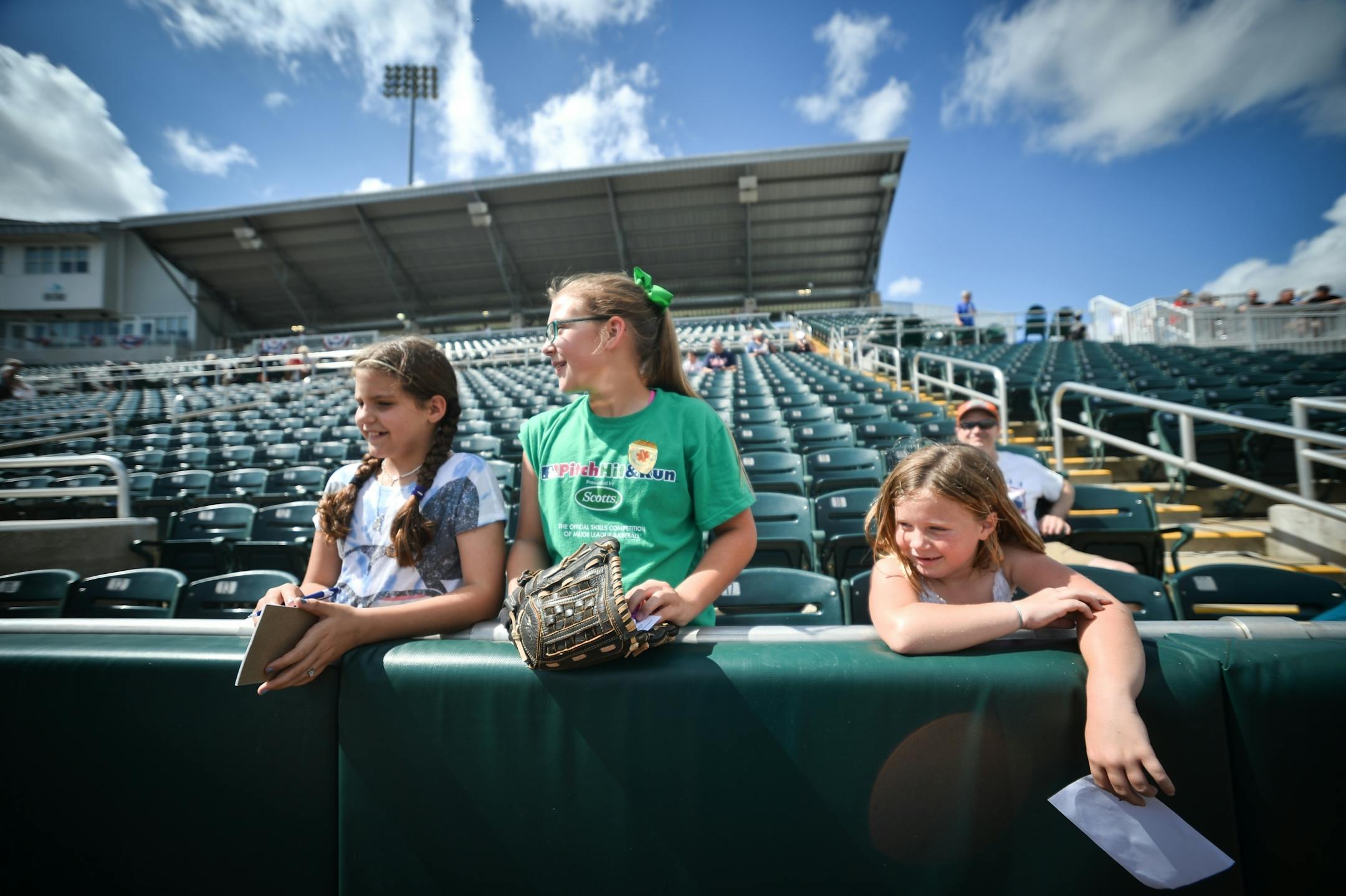 From left, Madison Means, 10, her older sister, Regan Means, and Kenna Kreuscher, 6, waited to get autographs during Sunday's Twins open house.