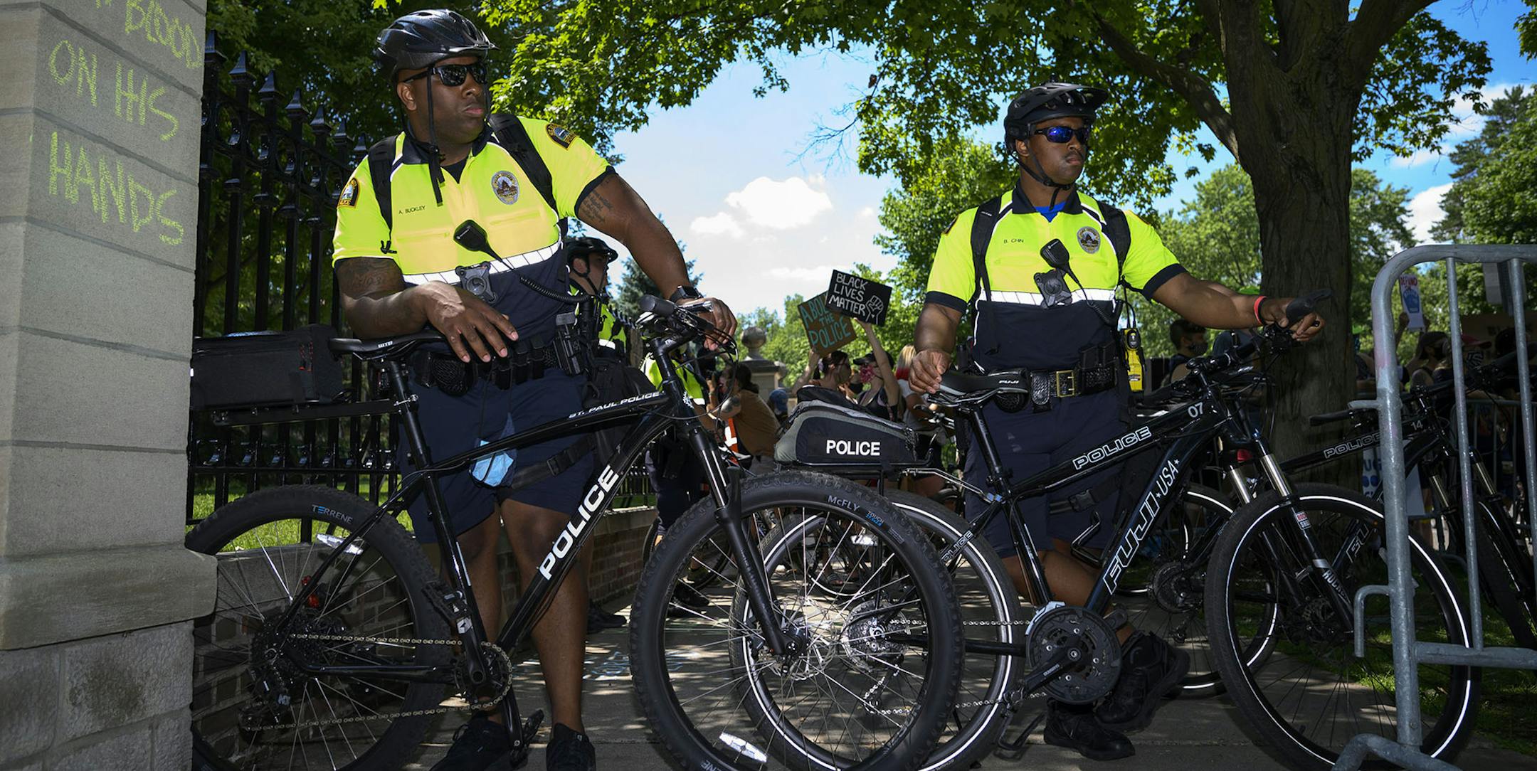 Saint Paul Police officers watched over Saturday's protest and counter protest outside the Minnesota Governor's Residence. ] aaron.lavinsky@startribune.com Pro-cop and anti-cop protesters faced off outside the Minnesota Governor's Residence on Saturday, June 27, 2020 in St. Paul, Minn. The pro-Trump group, "Bikers for 45" , organized the "Support the Police Rally" and were met, and outnumbered, by counter protesters. ORG XMIT: MIN2006271627073999