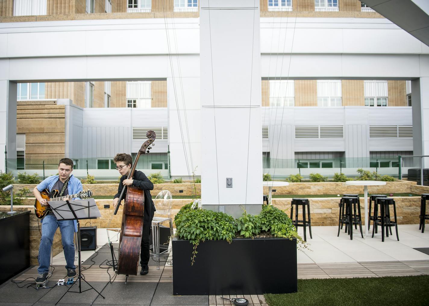 Will Schmid, on guitar, and Charlie Lincoln performed as a jazz duo during a resident gathering at the newly opened Custom House Apartments in St. Paul.