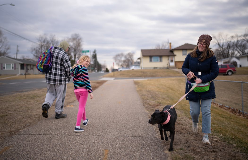 Abigail Turner walked her dog, Martha, near her South St. Paul home on February 13, 2024. Though covered by insurance, Martha is going to have dental surgery soon.