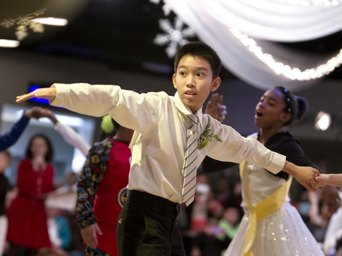 Dominic Schmidt, 10, dances with his partner in the Colors of the Rainbow Dancing Classrooms Team Match presented by Heart of Dance at Dancers Studio in St. Paul December 13, 2015. (Courtney Perry/Special to the Star Tribune)