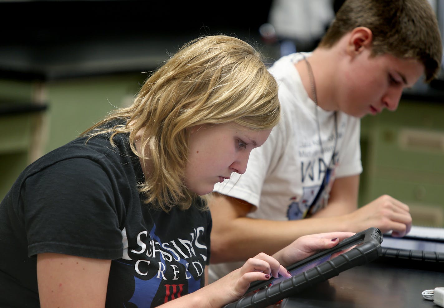 Sophomore Grasha Lund, 15, learned to use her new ipad during a Biology class at Waconia Senior High School, Wednesday, September 4, 2013. A new fiber optic broadband system was dedicated at Waconia Senior High School. It will connect 86 community organizations in Carver County. Most of the $7 million project came from federal funds, and features an 89-mile underground fiber ring that will link all 11 cities in the county. (ELIZABETH FLORES/STAR TRIBUNE) ELIZABETH FLORES &#x2022; eflores@startri