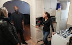 Kelly Bridges and his partner Breeanna talked with their Hennepin County case manager Krissy Svensson in their new apartment Friday in St. Paul. The c