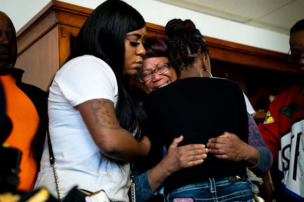 Nancy Davis, Zaria McKeever's aunt, with other family members during a small prayer vigil at Shiloh Temple on Friday in Minneapolis.