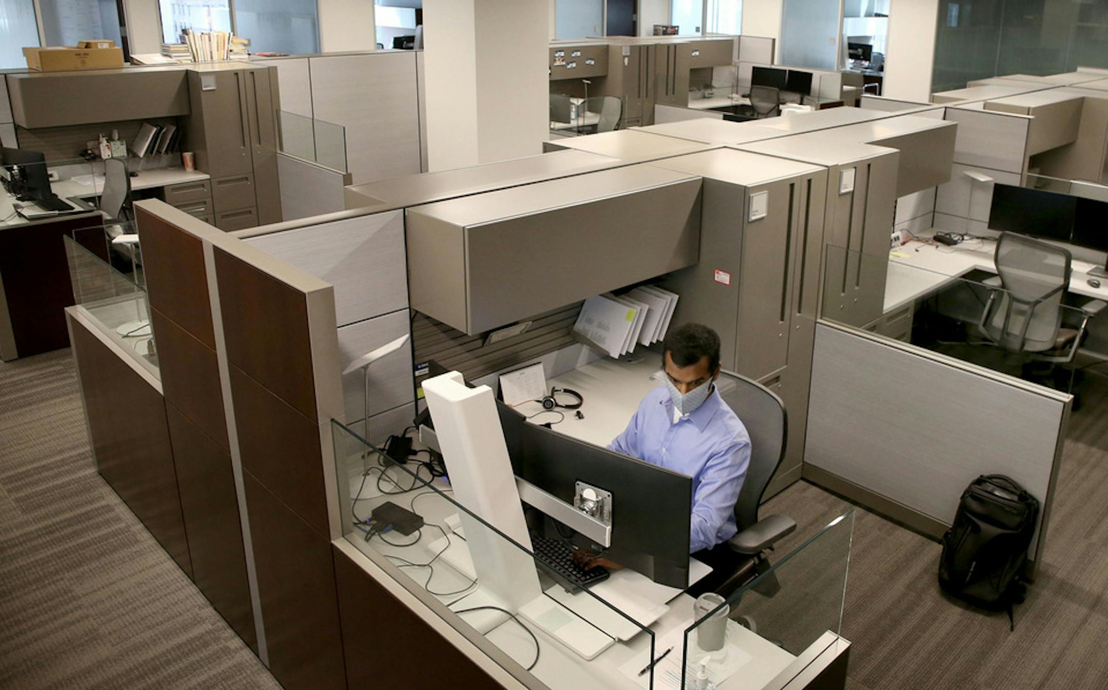 Sikich senior account Priyank Shah works alone in a 25,000 square foot space at the Sikich's office in downtown Chicago, as most of his co-workers work from home due to the coronavirus pandemic, Tuesday, Aug. 18, 2020. (Antonio Perez/ Chicago Tribune/TNS)