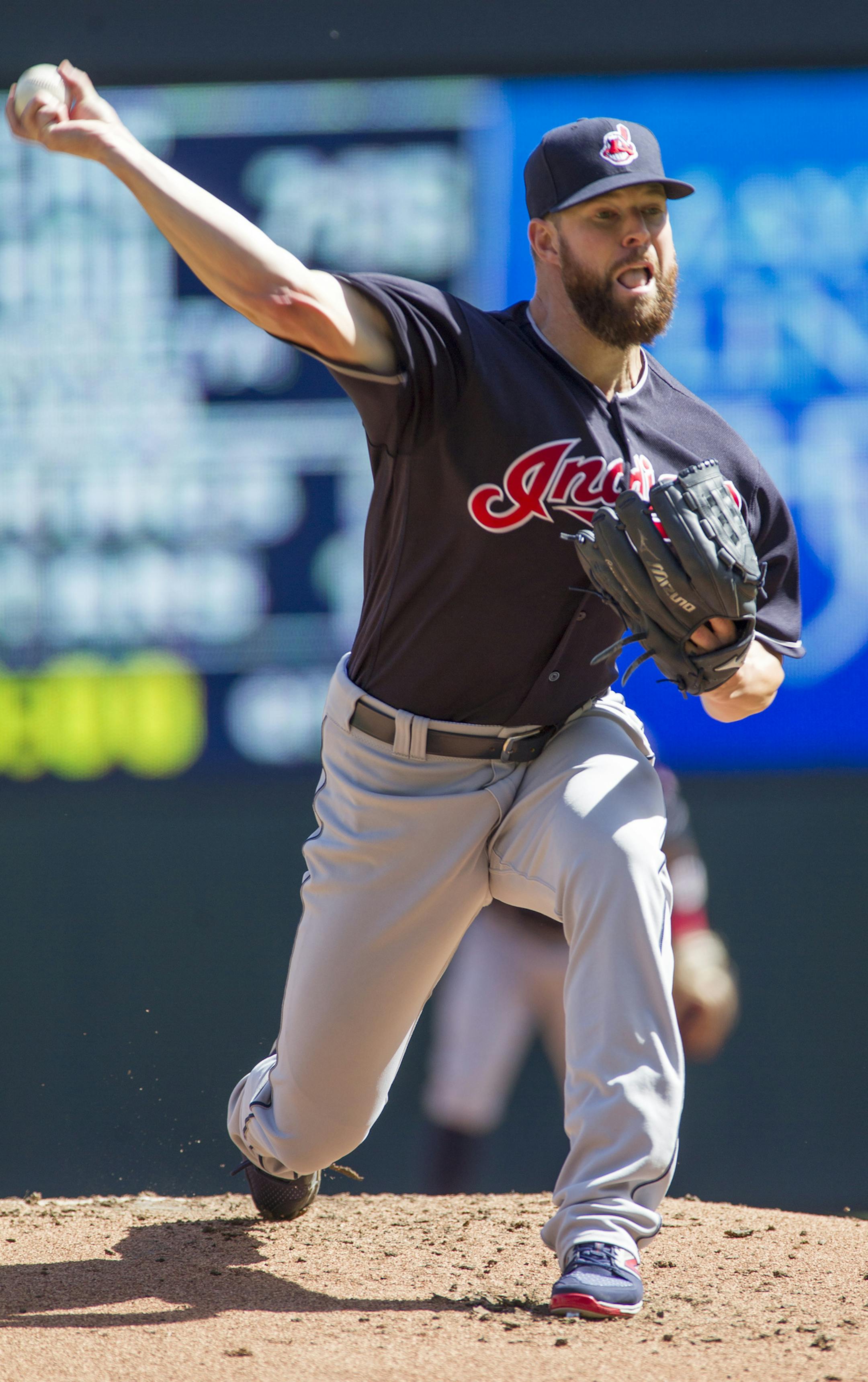 Cleveland Indians starting pitcher Corey Kluber delivers against the Minnesota Twins during the first inning of a baseball game, Sunday, Sept. 11, 2016, in Minneapolis. (AP Photo/Paul Battaglia)
