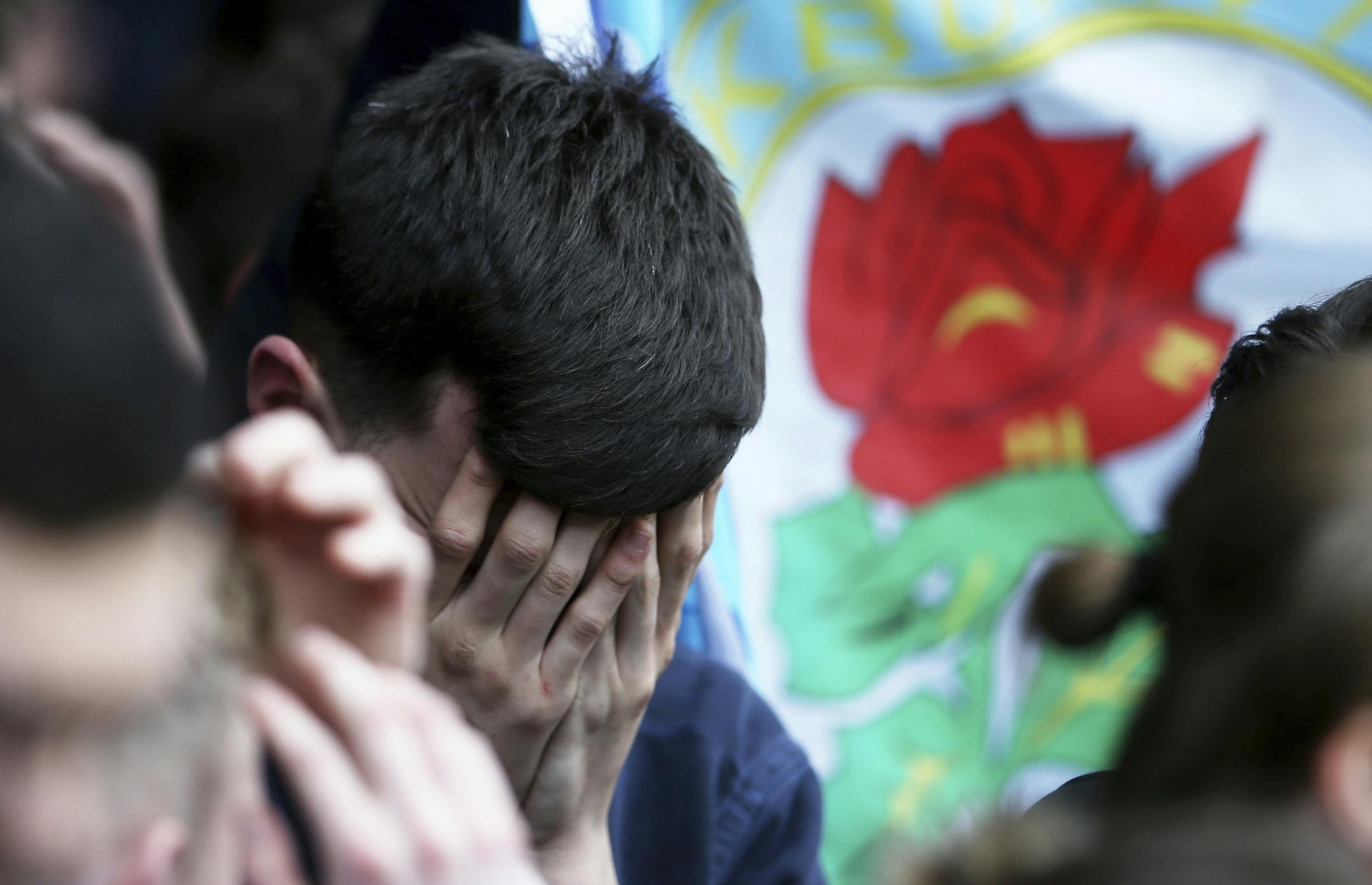 Blackburn Rovers fans are dejected after the final whistle during their English Championship soccer match against Brentford at Griffin Park, London, Sunday, May 7, 2017. Blackburn&#xed;s slide down the English soccer league plunged further on Sunday when the former Premier League champion was relegated to the third tier, intensifying the club&#xed;s woes under its Indian owners. (Scott Heavey/PA via AP)