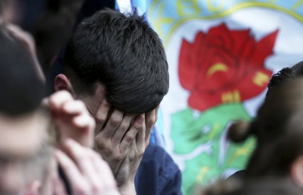 Blackburn Rovers fans are dejected after the final whistle during their English Championship soccer match against Brentford at Griffin Park, London, S