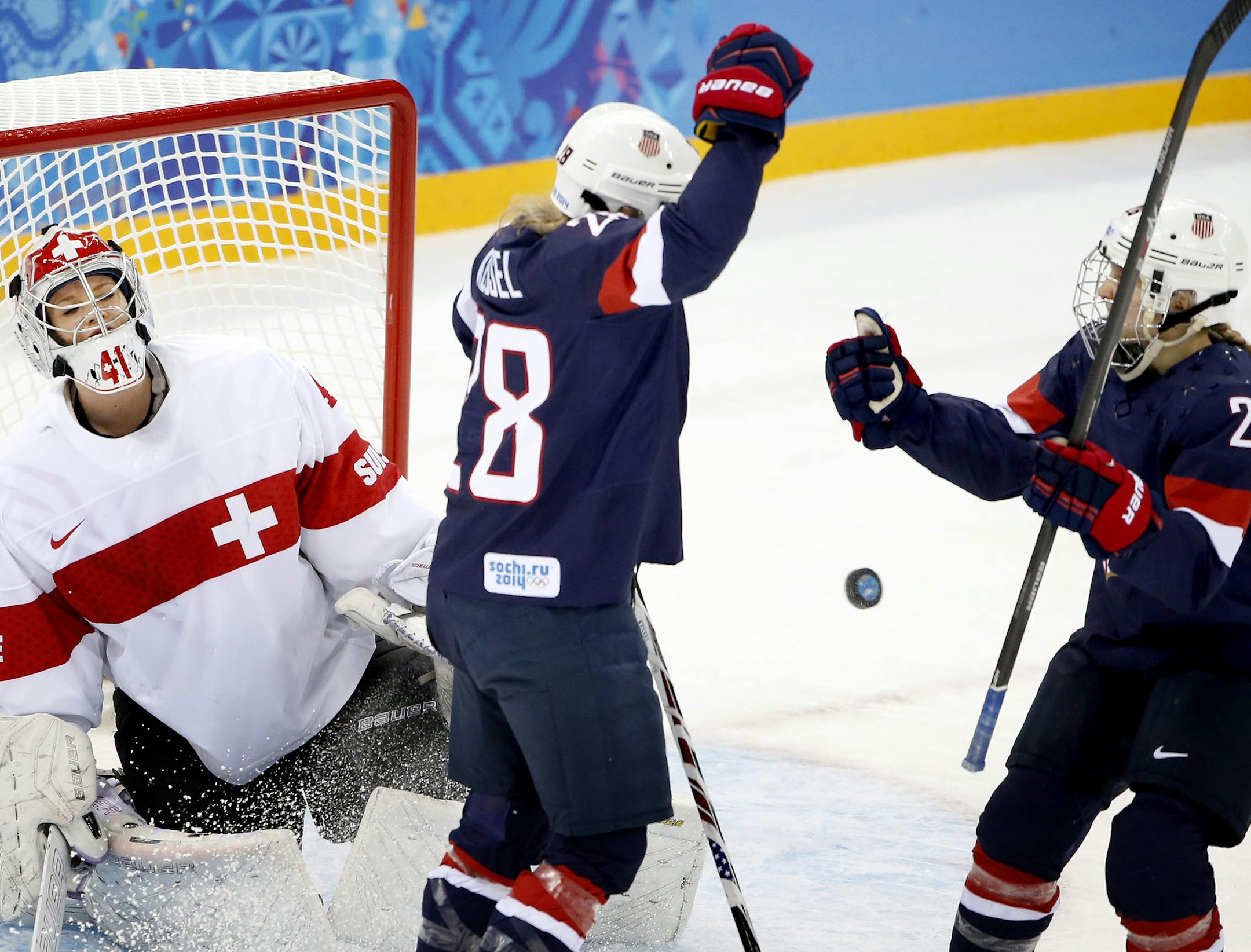 Amanda Kessel (28) celebrated with Kendall Coyne (26) after scoring on Switzerland goalie Florence Schelling (41) in the first period. Kessel had two goals in the game. USA beat Switzerland by a final score of 9-0 at Shayba Arena on Monday. ] CARLOS GONZALEZ cgonzalez@startribune.com - February 10, 2013, Sochi, Russia, Sochi 2014 Winter Olympics, Shayba Arena, Women's Hockey, Team USA vs. Switzerland