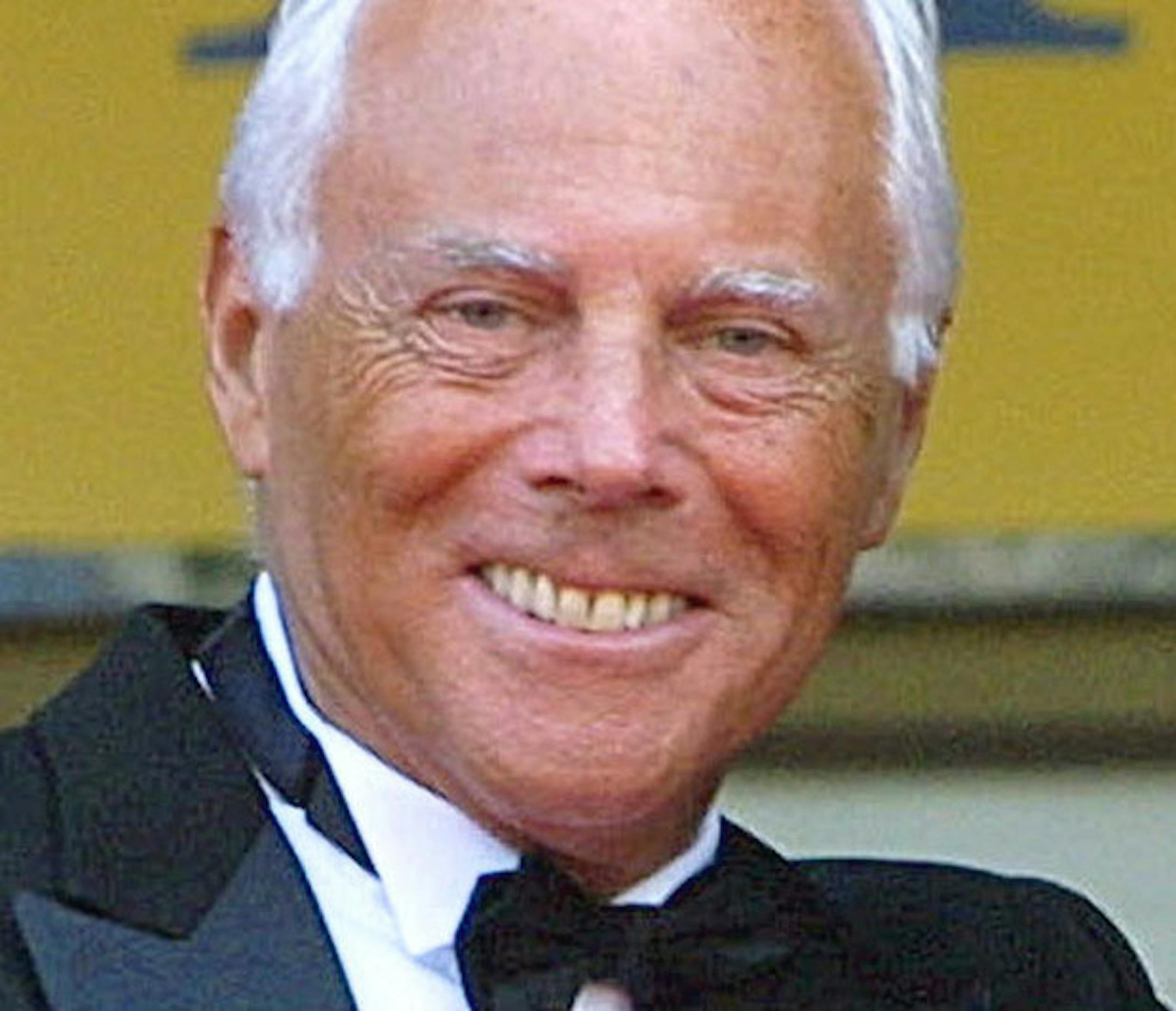 Italian designer Giorgio Armani poses as he arrives at the Festival Palace to attend the screening of "Gangs of New York" at the 55th International Film Festival in Cannes, southeastern France, Monday, May 20, 2002. Armani will become the United Nations' latest celebrity ambassador at a ceremony in his home country, the U.N. refugee agency said Tuesday, May 28, 2002. (AP Photo/Michel Euler)