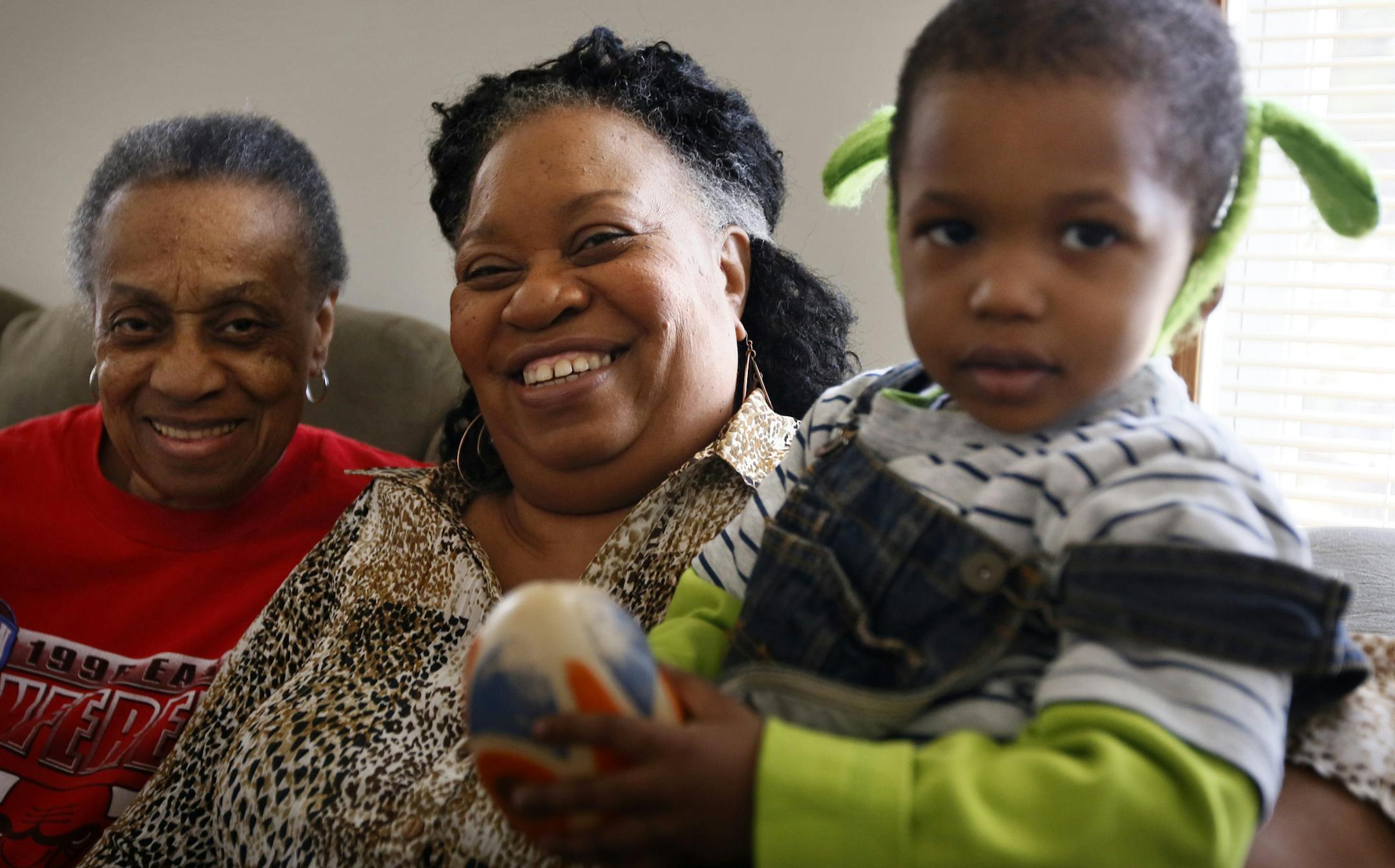 Karen Ray (center) was pulling double duty Monday afternoon, watching her mother Francis Reed (left) and grandson Messiah, 3. Minnesota could save almost $1 billion if it implements a program giving support to caregivers like Karen. ] BRIAN PETERSON ‚Ä¢ brian.peterson@startribune.com Brooklyn Park, MN 4/04/2014