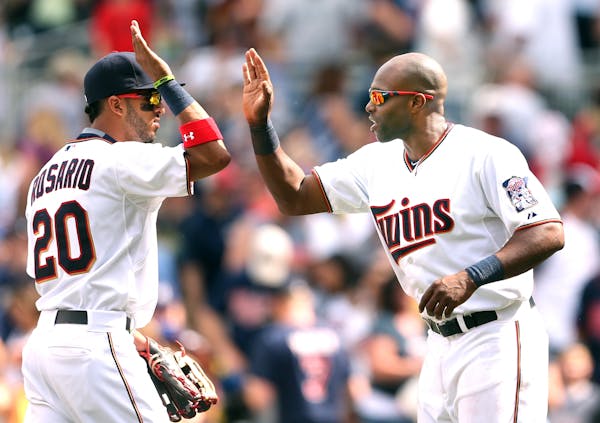 Eddie Rosario left and Torii Hunter celebrated a win at Target Field Sunday June 7, 2015 in Minneapolis, MN.