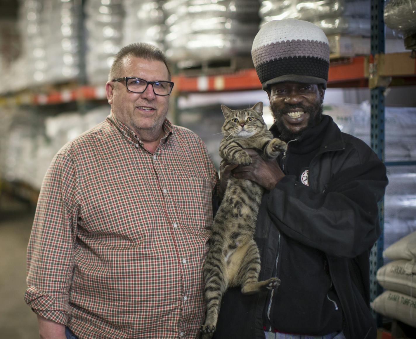 Ramy Turf manager Jim Trenter and employee Everton "Fireside" Deans, with Fritz. Since arriving earlier this year, Fritz has become the business&#x2019; unofficial mascot.