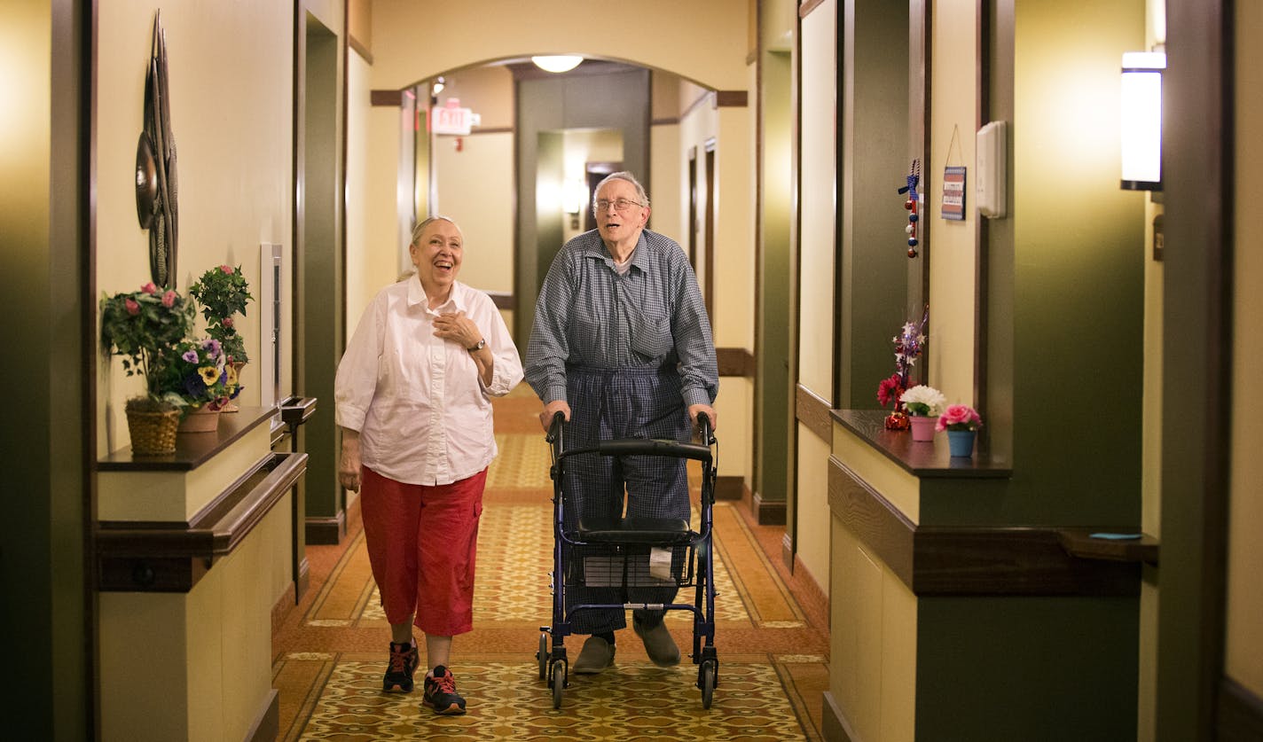 Right at Home caregiver Judy Trest walks with Howard Andrea, 78, to the laundry room inside his home in the Shores of Lake Phalen assisted living facility in Maplewood. ] (Leila Navidi/Star Tribune) leila.navidi@startribune.com BACKGROUND INFORMATION: Wednesday, June 8, 2016 in Maplewood. Right at Home ranks at the top of the list of medium-sized companies in Top Workplaces. Employees lauded the company for flexible hours, communication despite most employees working outside the office, and lead