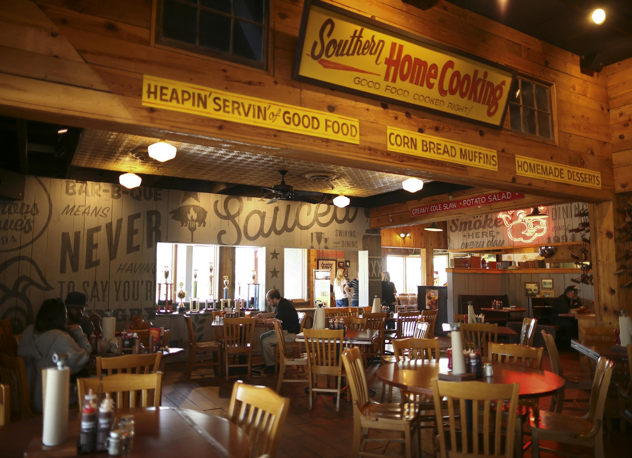 A portion of the updated dining area at the Famous Dave's location in Maple Grove. ] JEFF WHEELER ï jeff.wheeler@startribune.com To counter sales declines, Famous Dave's is refreshing their branding, starting with their Maple Grove location. Founder Dave Anderson and Chief Marketing Officer Alfredo Martel were on hand for the launch event Tuesday evening, September 20, 2016.