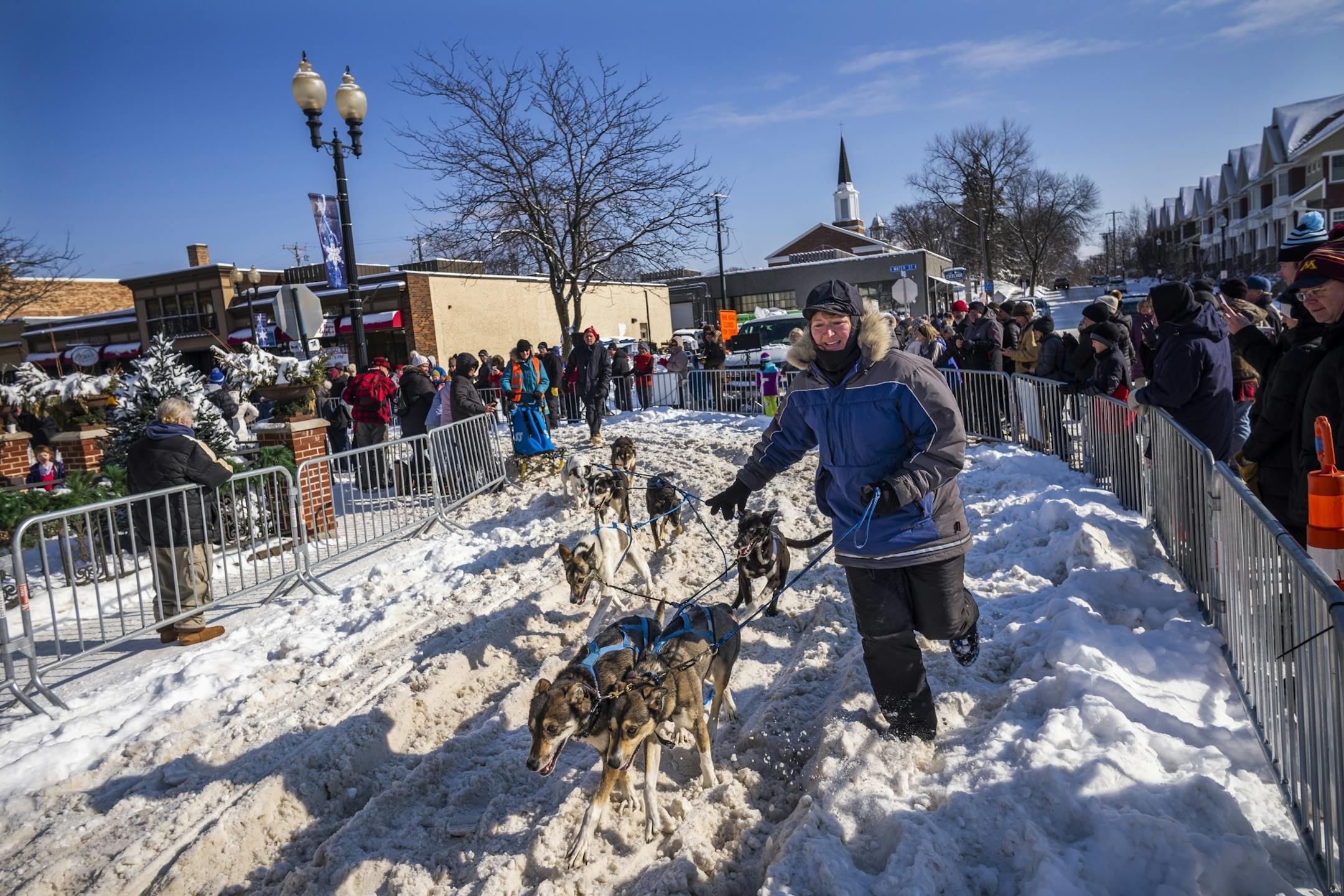 Joanna Oberg (11) of Grand Marais took her dogs back to the kennel after crossing the finish line.