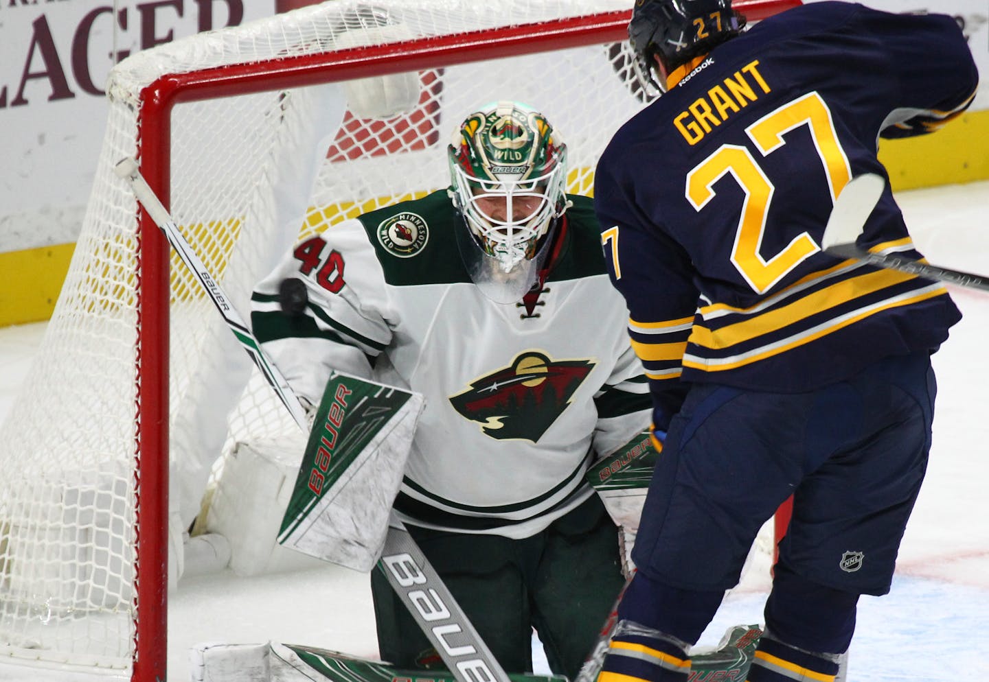 Buffalo Sabres' Derek Grant (27) is stopped by Minnesota Wild goalie Devan Dubnyk (40) during the second period of an NHL hockey game, Thursday, Oct. 27, 2016, in Buffalo, New York. (AP Photo/Jeffrey T. Barnes)