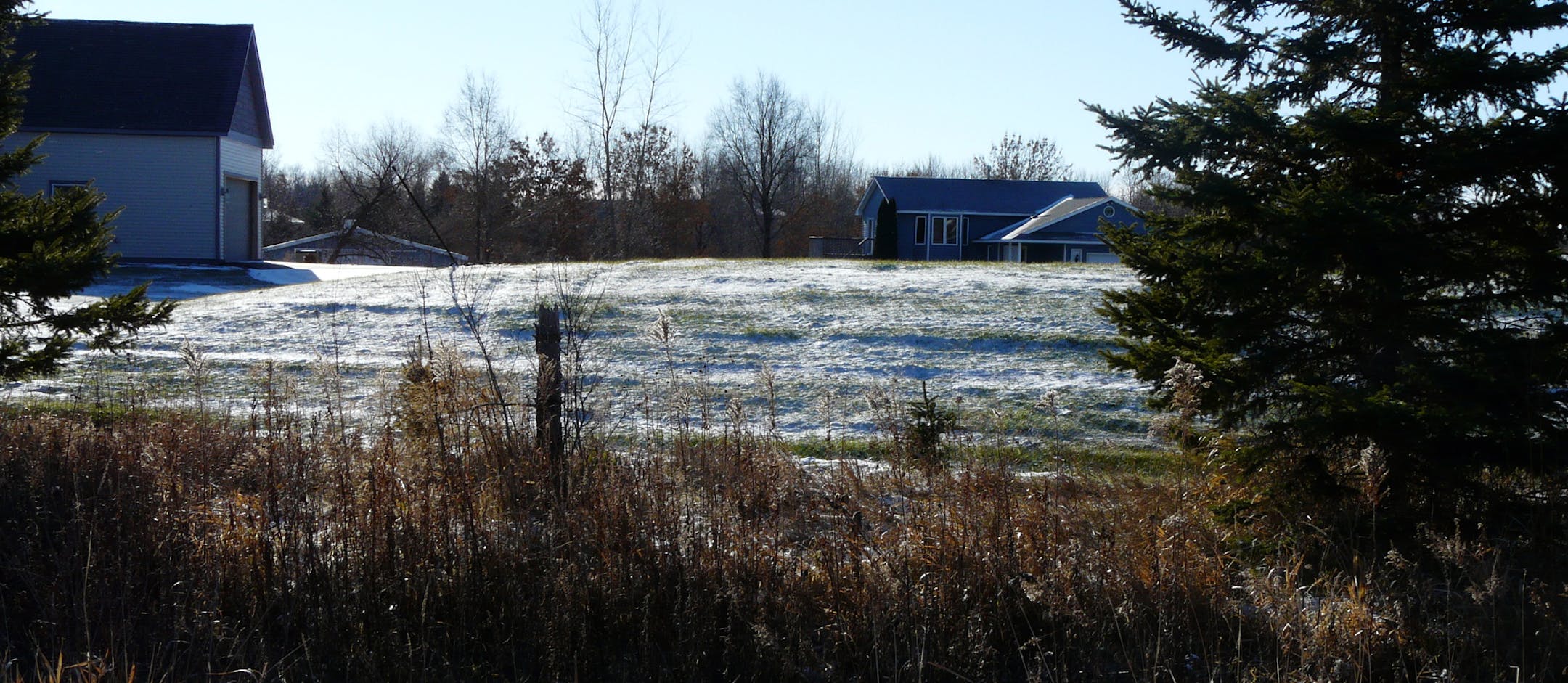 Photo by David Peterson The Anderson family's home is on the left, just a short distance from the Rudoph group home, on the right.