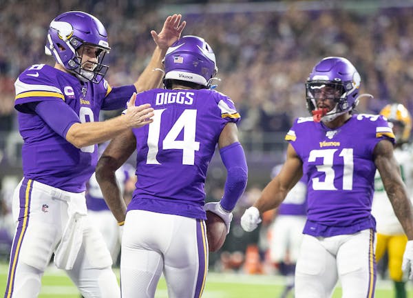Kirk Cousins congratulated Stefon Diggs after a touchdown against Green Bay in December.