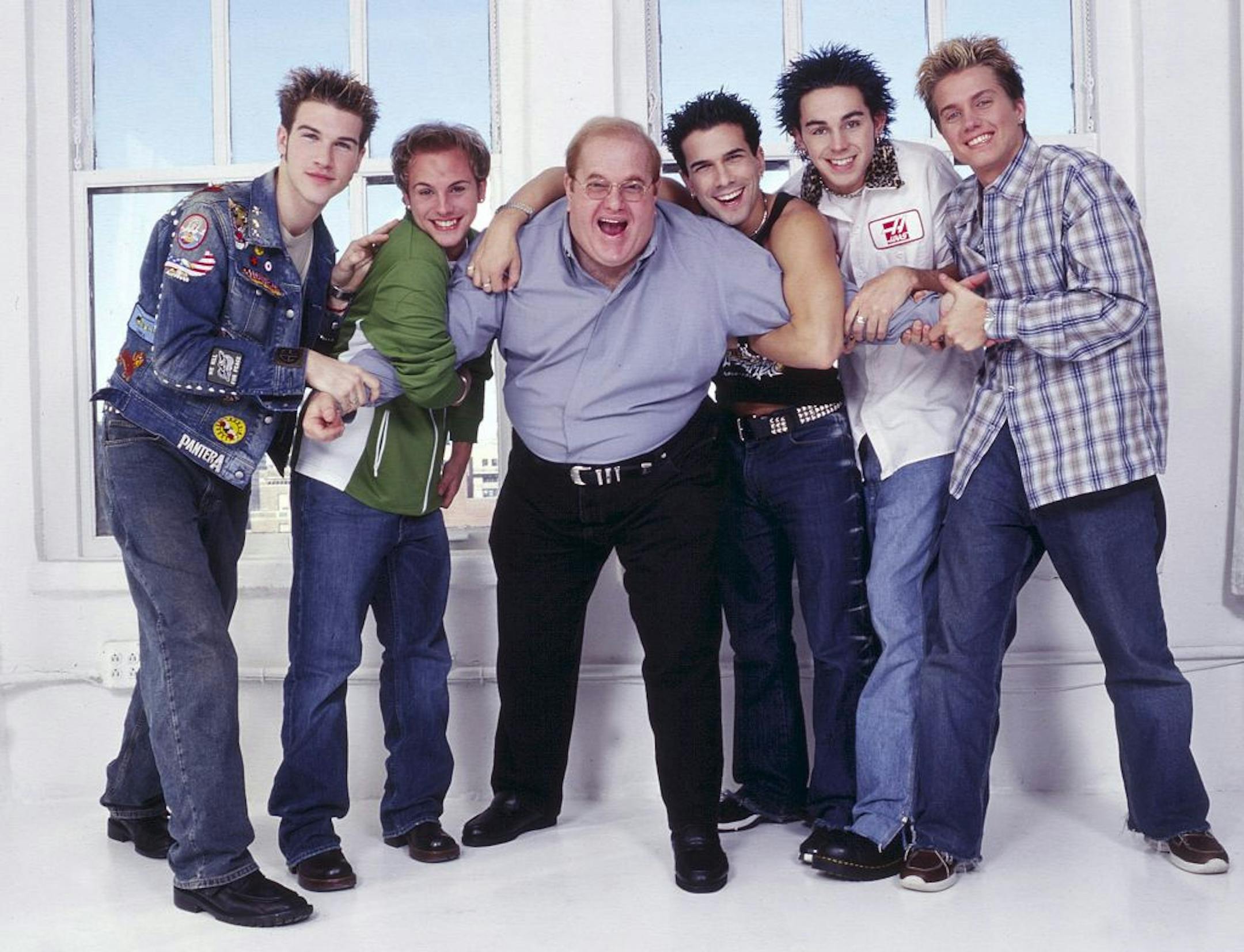 NEW YORK - CIRCA 2001: Lou Pearlman poses with boy band O-Town, Jacob Underwood, Ashley Parker Angel, Erik Estrada, Trevor Penick and Dan Miller seen in New York, circa 2001.