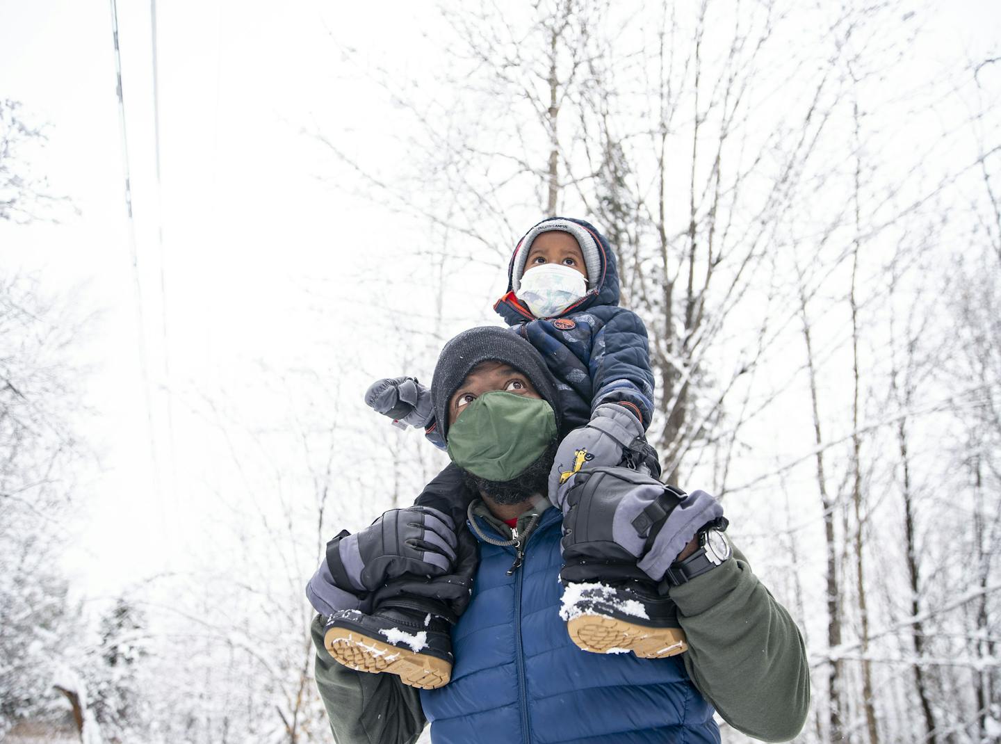 Glenn Simmons Jr. carried his son Kai, 2, atop his shoulders during an outing in Bagley Nature Area in Duluth. The group has met weekly for about three years.