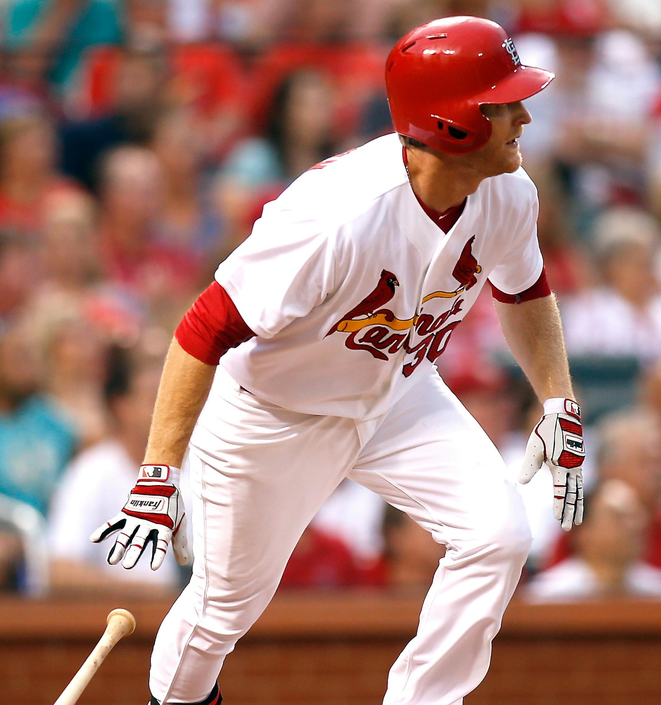St. Louis Cardinals' Dan Johnson watches the ball as he heads for first base during the second inning of a baseball game against the Cincinnati Reds Monday, July 27, 2015, in St. Louis. (AP Photo/Scott Kane) ORG XMIT: MOSK215