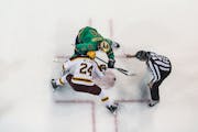 Jaxon Nelson of the Gophers and Danny Nelson of Notre Dame squared off in the faceoff circle Friday night in South Bend.