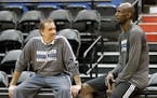 Minnesota Timberwolves star Kevin Garnett, right, talks with head coach Flip Saunders after his first practice upon his return to the former team that