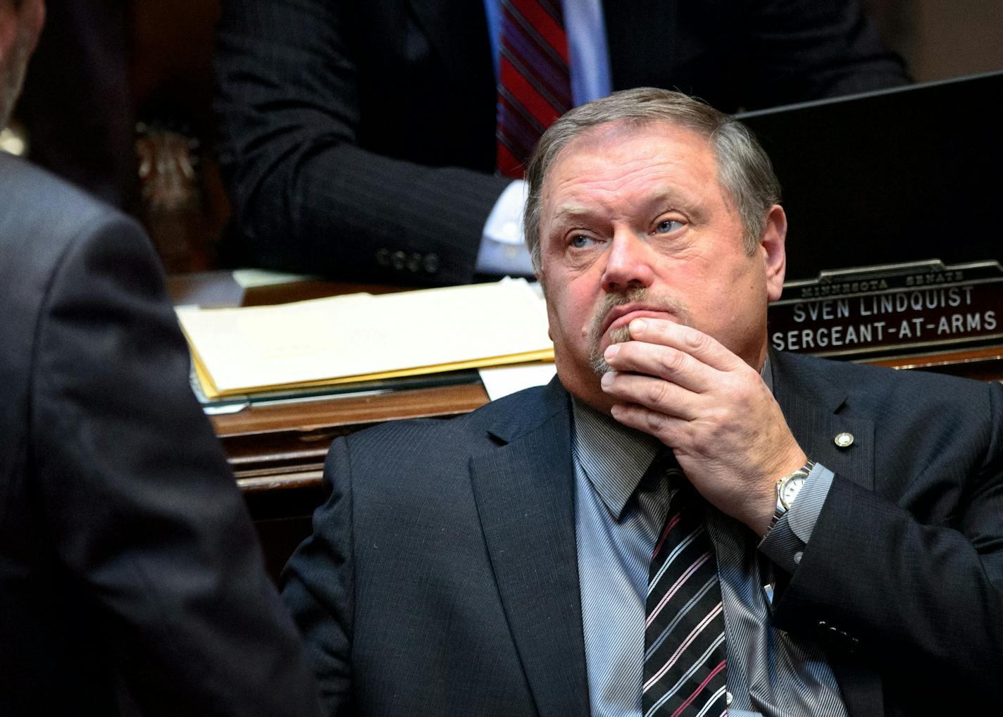 Majority Leader Tom Bakk rubbed his chin as he spoke with Sen Rod Skoe while the Senate debated the bill with Bakk's amendment that would delay raises for Governor Dayton's commissioners. ] GLEN STUBBE * gstubbe@startribune.com Thursday, February 12, 2015