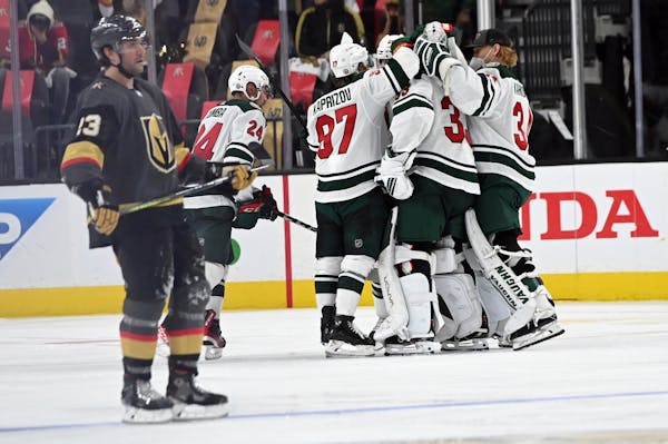 The Minnesota Wild celebrate their overtime victory over the Vegas Golden Knights in Game 1 of a first-round NHL hockey playoff series Sunday, May 16,