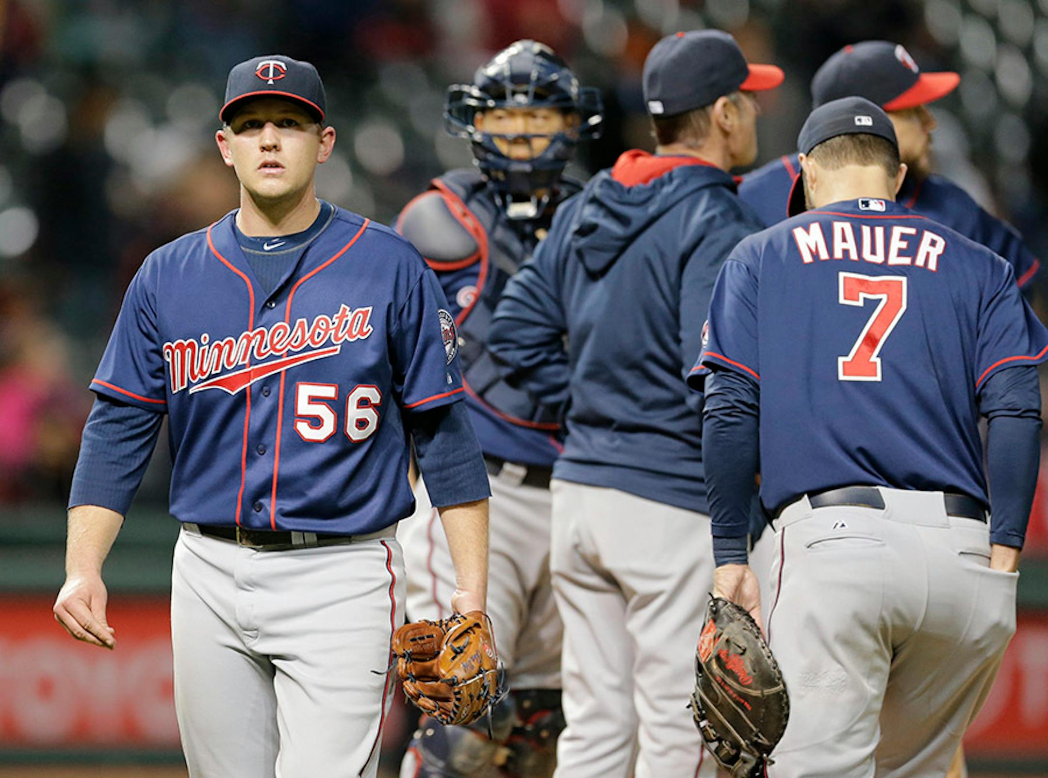 Minnesota Twins starting pitcher Tyler Duffey (56) walks to the dugout after giving up a two run home run to Cleveland Indiansí Roberto Perez in the seventh inning of a baseball game, Thursday, Oct. 1, 2015, in Cleveland. (AP Photo/Tony Dejak)