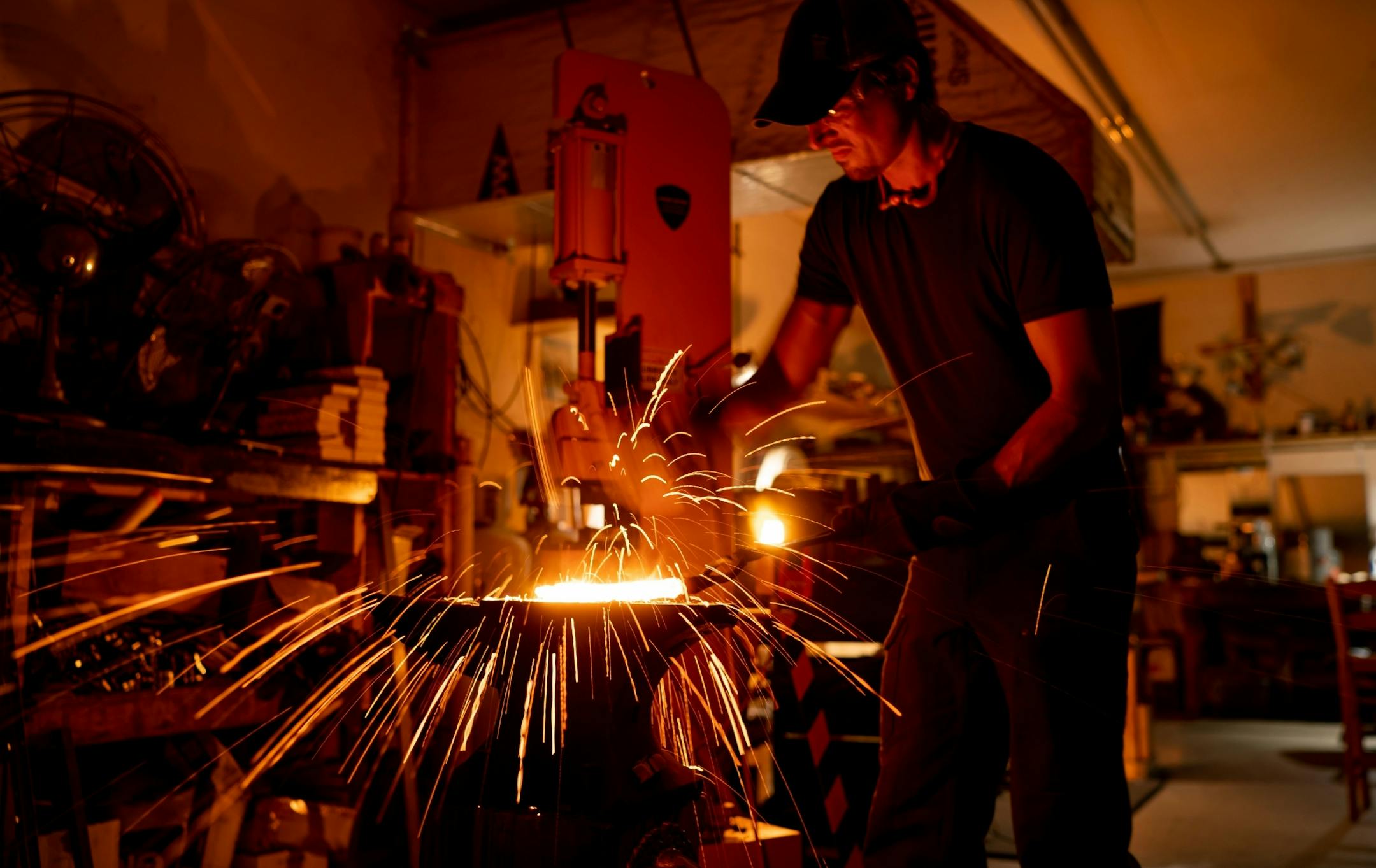 Jason Kraus heated a length of steel cable to 2200 degrees to begin the process of turning it into a knife blade.