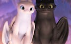 The female Light Fury dragon and Night Fury dragon Toothless in DreamWorks Animation&#x2019;s "How To Train Your Dragon: The Hidden World," directed b