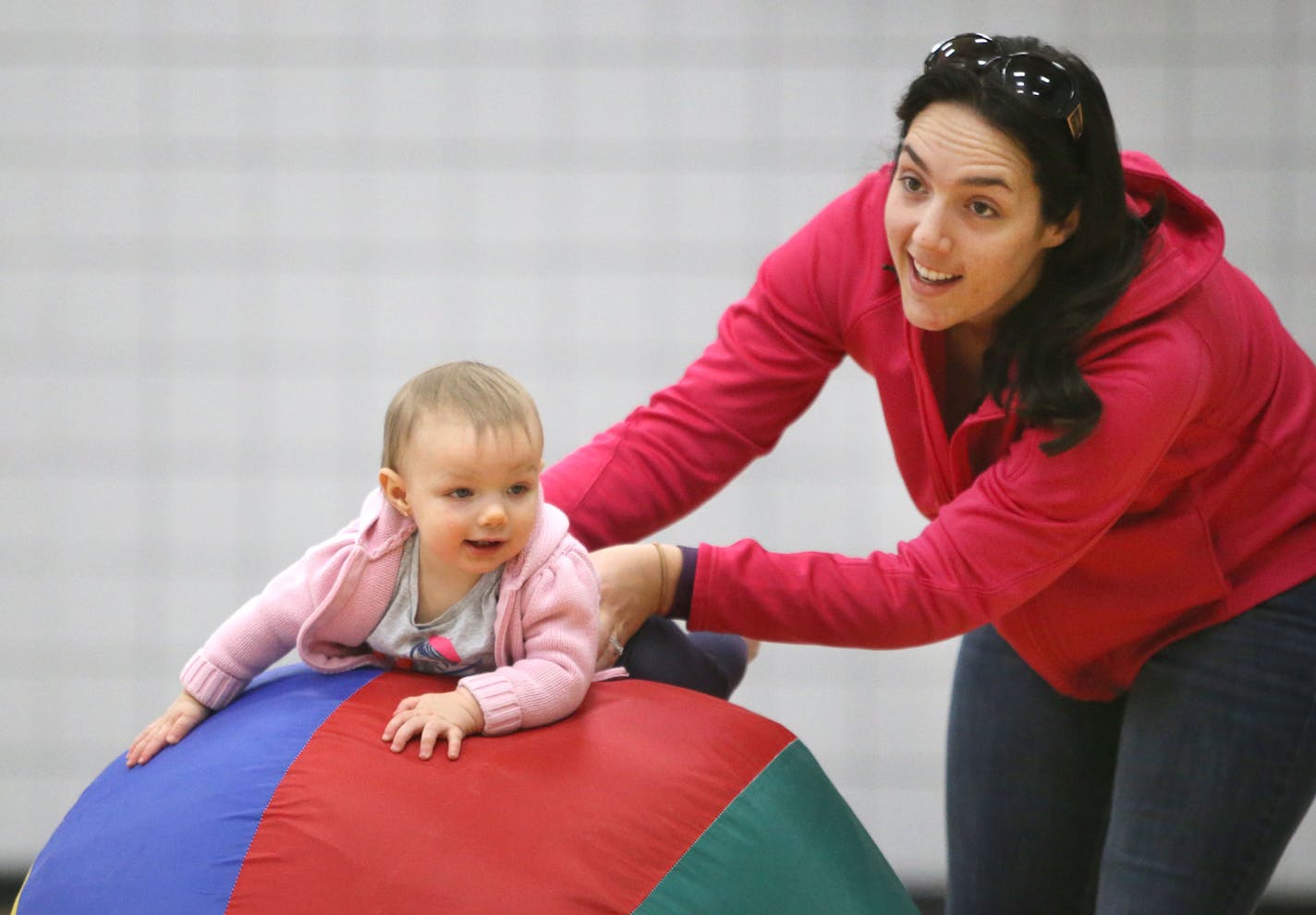 Amanda Peters of St. Paul guides her daughter Aubrey, 10 months, atop a big ball during toddler time at the Palace Community Center Saturday, Feb. 13, 2016, in St. Paul, MN. Andy, Amanda and Tammy came to the Palace as young children."We all grew up coming here," said Peters' husband Andy. "I like it here. It's a pretty good thing for the community."](DAVID JOLES/STARTRIBUNE)djoles@startribune.com Some communities have felt slighted by St. Paul's closures of certain recreation centers. Council M