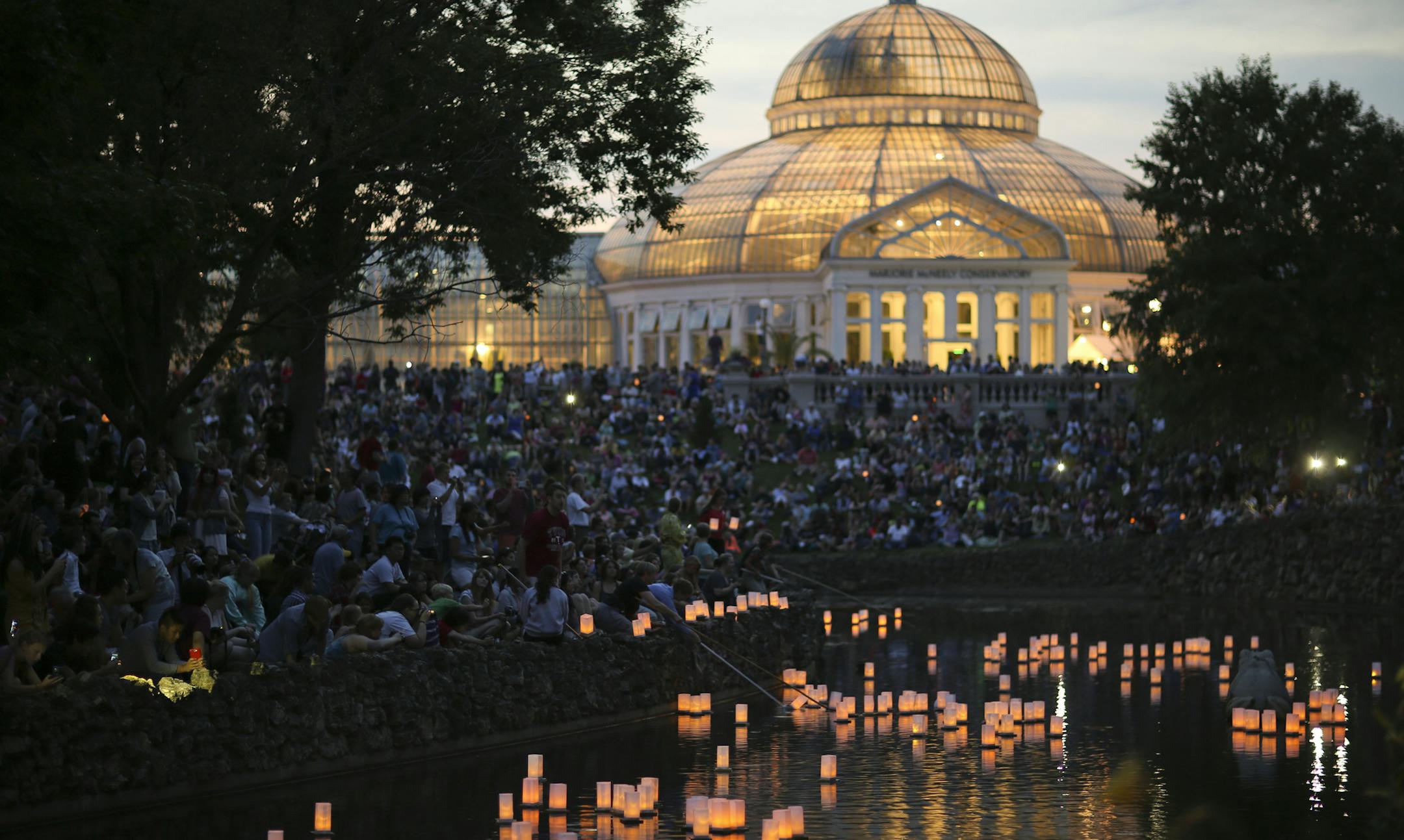 The 16th annual Como Park Japanese Lantern Lighting Festival, a family-friendly event, reminiscent of Japan's annual Obon holiday, was on Sunday afternoon and evening, August 18, 2013 on the grounds of the Marjorie McNeely Conservatory in Como Park in St. Paul. 230 lanterns were lit and launched in the Frog Pond to top off the Lantern Lighting Festival Sunday night. ] JEFF WHEELER ‚Ä¢ jeff.wheeler@startribune.com