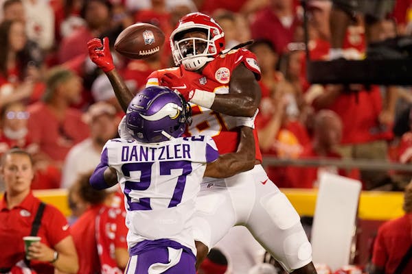 Minnesota Vikings cornerback Cameron Dantzler (27) breaks up a pass intended for Kansas City Chiefs wide receiver Daurice Fountain during the first ha