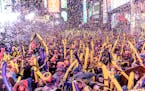 FILE -- Revelers celebrate the New Year's Eve ball drop at Times Square in Manhattan, Dec. 31, 2018. New Year's Eve 2019 is sure to see arguments over