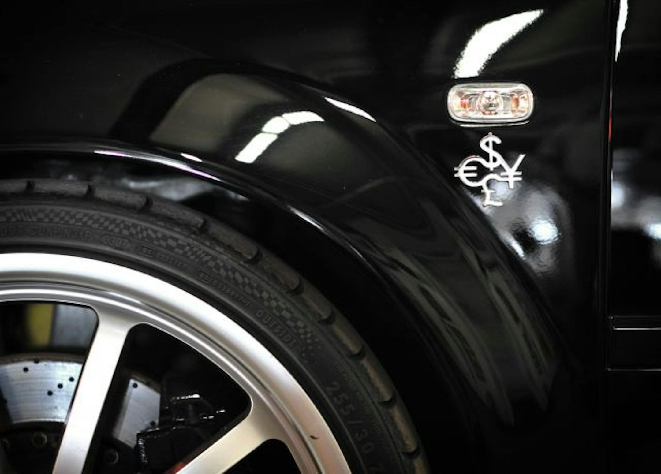 Currency symbols on the Audi's fender give a clue to its history. The car was so heavily modified it couldn't pass Swiss inspections.
